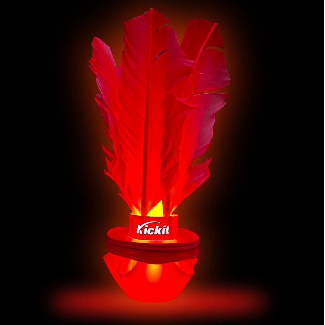 Red light-up Birdie Soccer Trainer with feathered shuttle design glowing against a dark background