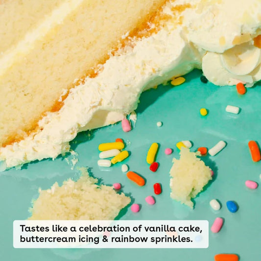Close-up of vanilla cake, buttercream icing and rainbow sprinkles showing the birthday cake lip balm flavor