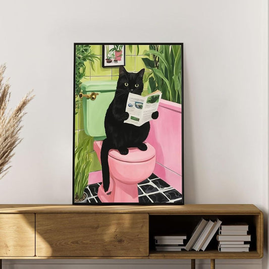 Framed paint-by-numbers artwork of a black cat reading a newspaper on a pink toilet in a colorful bathroom