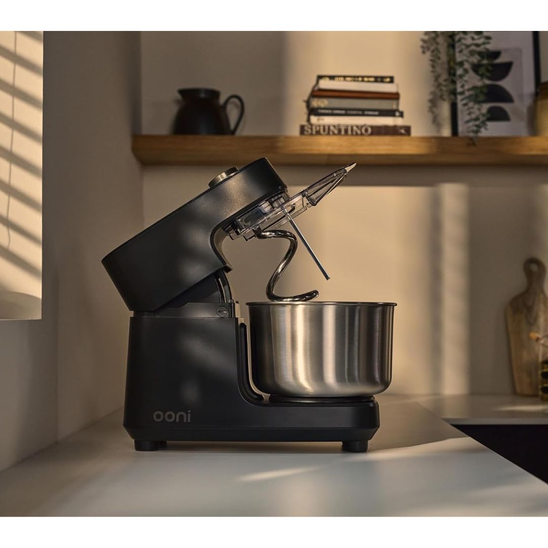 A black spiral dough mixer in a kitchen scenario
