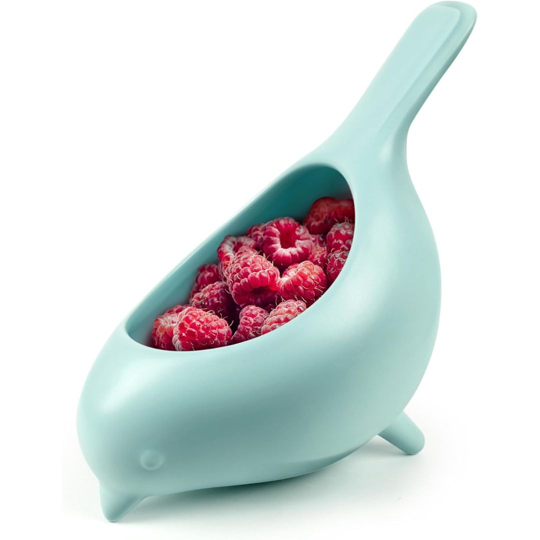 Blue bird ceramic berry colander filled with fresh berries