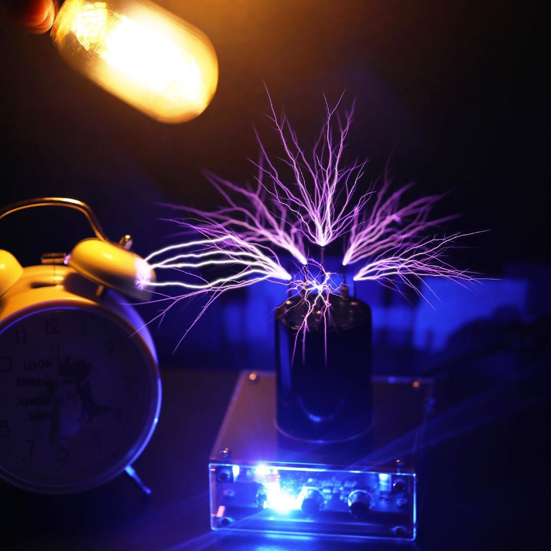 ZENT Bluetooth music Tesla coil producing purple electrical arcs beside a glowing light bulb and alarm clock