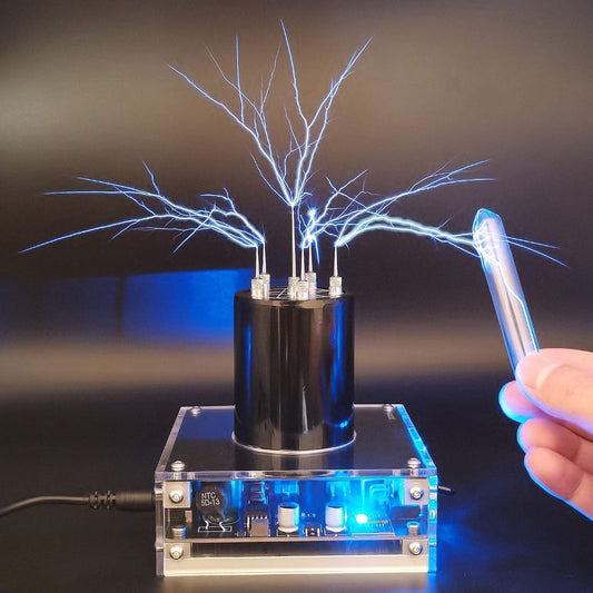 ZENT JE-19 Tesla coil arc generator producing blue electrical sparks toward a handheld glass tube