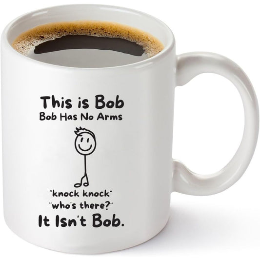 A full coffee cup with text 'This is Bob, Bob has no arms, knock knock who's there, it isn't Bob'
