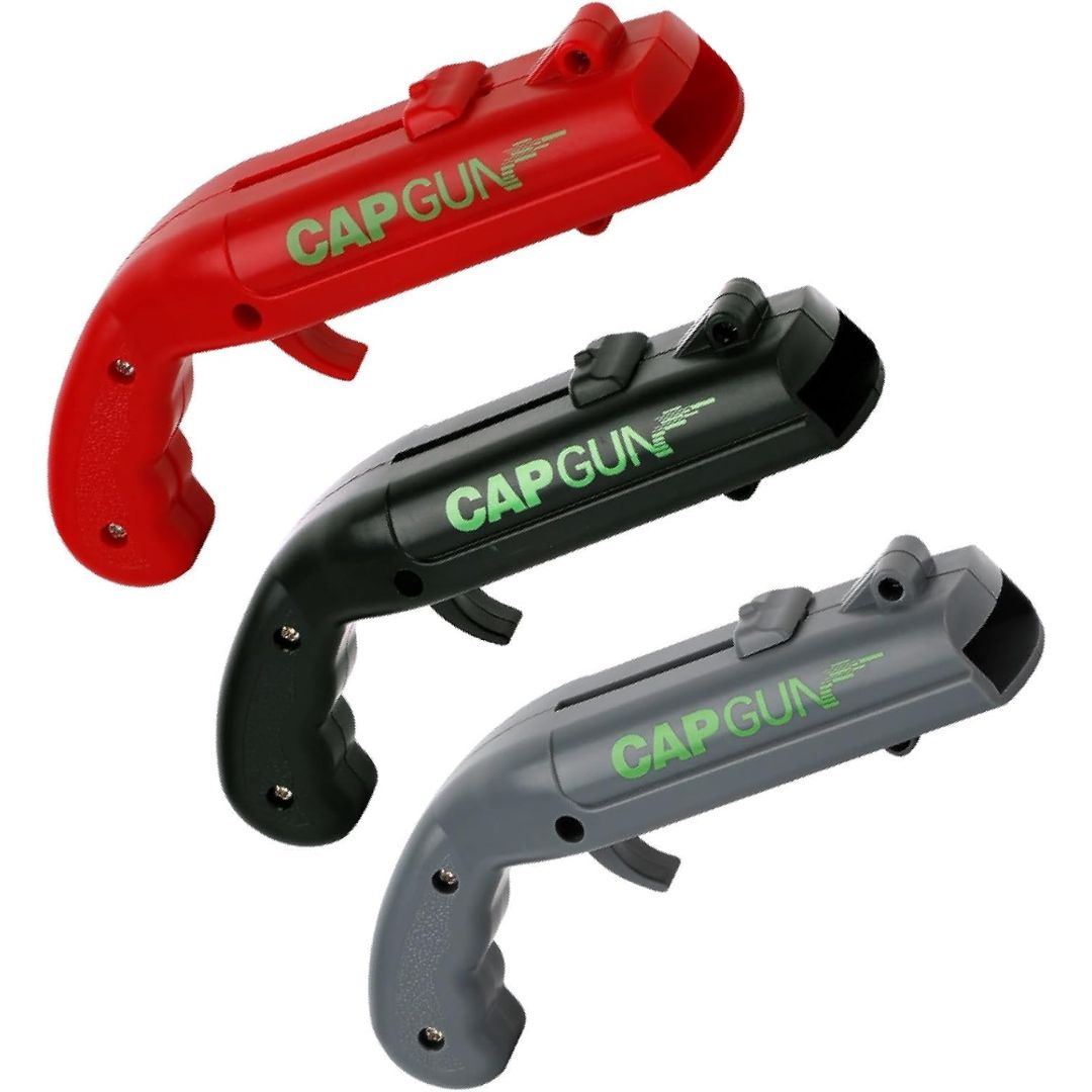 Three bottle cap launcher guns on a white background