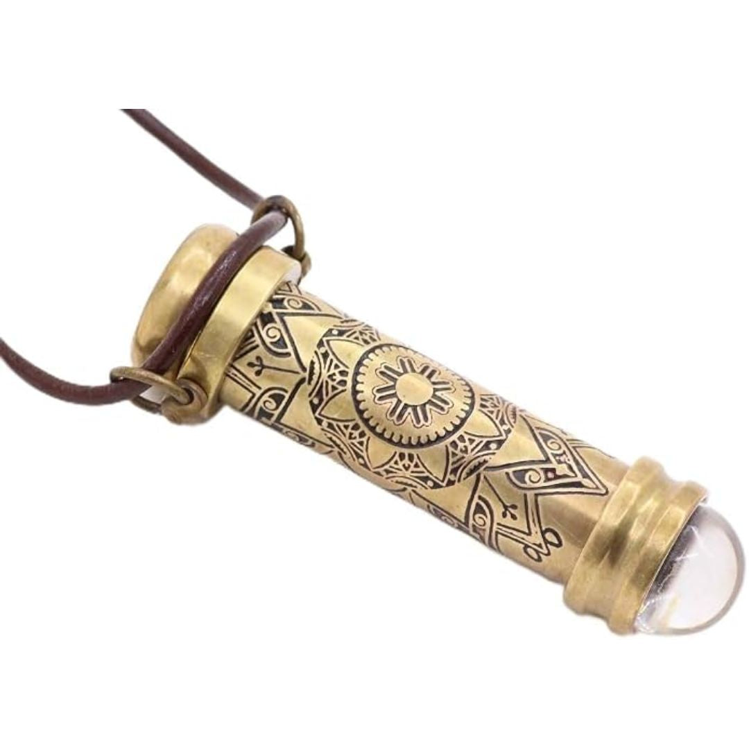 A brass teleidoscope necklace on a white background