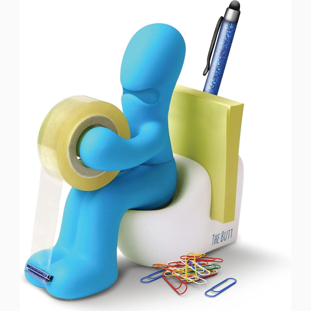 Blue novelty character sitting on a toilet and holding tape and office supplies