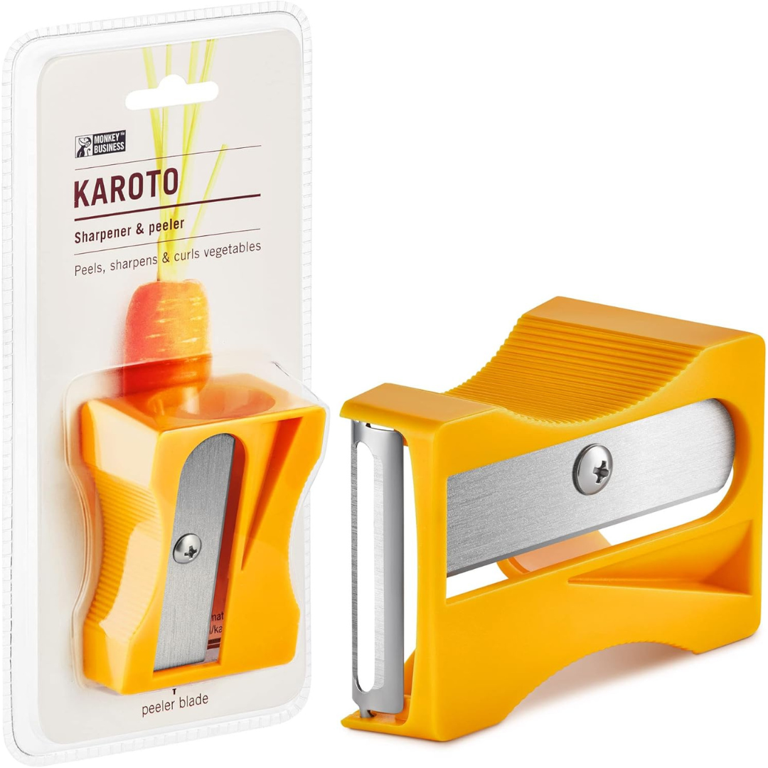 Orange sharpener-shaped vegetable peeler labeled "Karoto," shown both in packaging and out, designed to peel, sharpen, and curl vegetables like carrots.