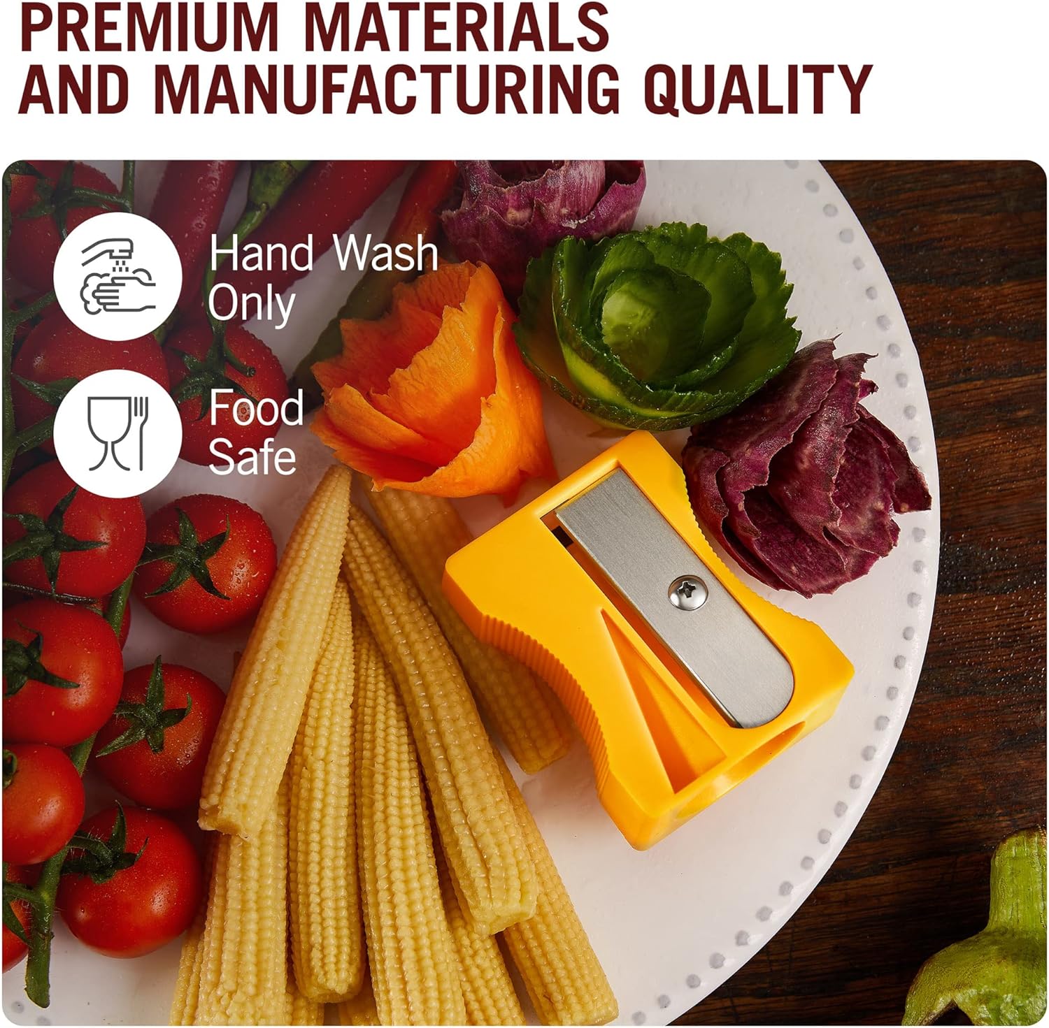Yellow carrot sharpener on a plate with baby corn, cherry tomatoes, and vegetable flower garnishes, labeled as food safe and hand wash only.