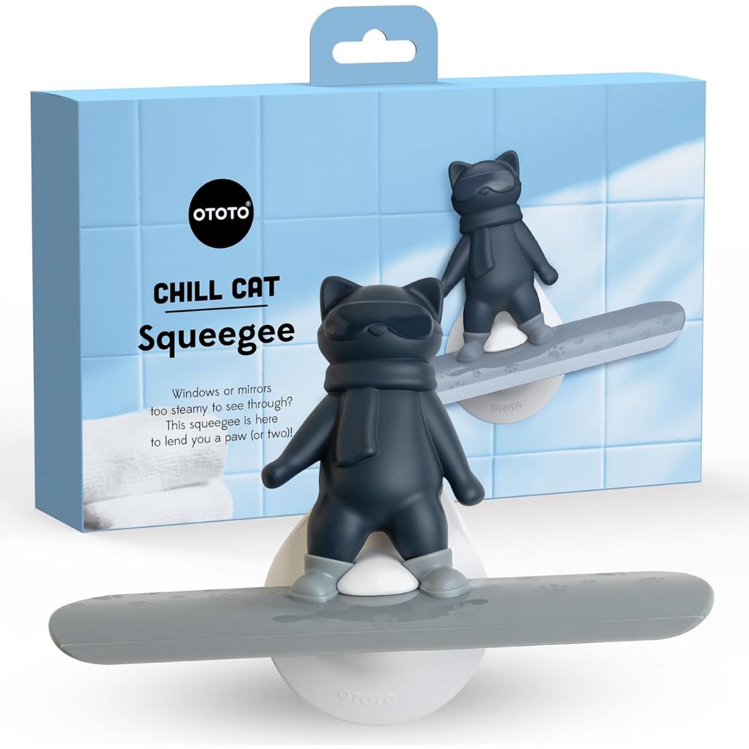 A shower squeegee shaped like a cat on a snowboard.