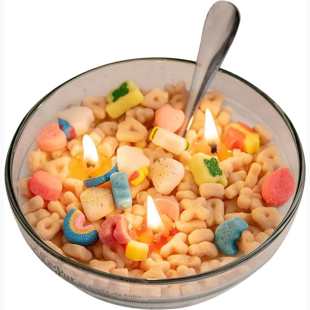 Bowl of colorful cereal with candles on a white background