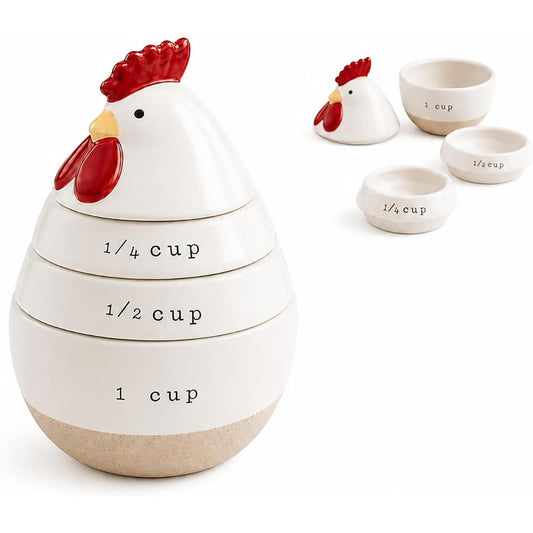 A ceramic egg-shaped measuring set shaped like a rooster, with stacked cups labeled 1/4 cup, 1/2 cup, and 1 cup. The rooster has a white body, red comb and wattle, a small yellow beak, and a beige base.