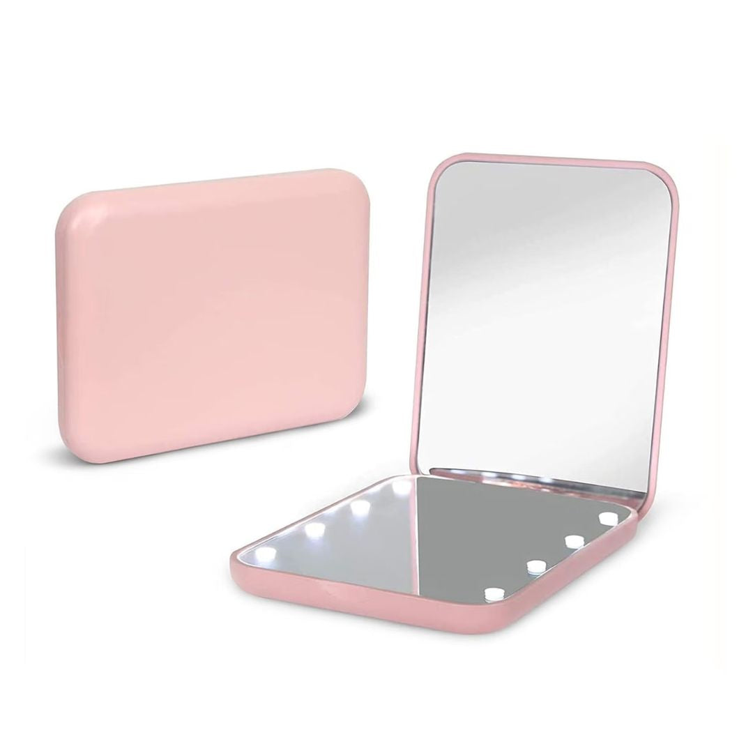 Pink compact mirror with internal lights on a white background