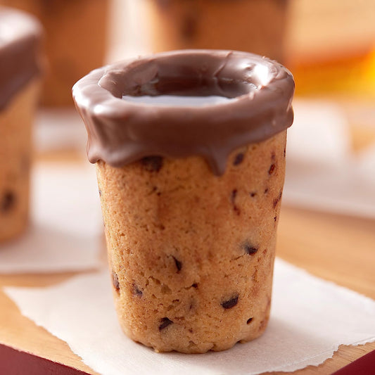 A shot glass made from cookie dough with a chocolate rim.