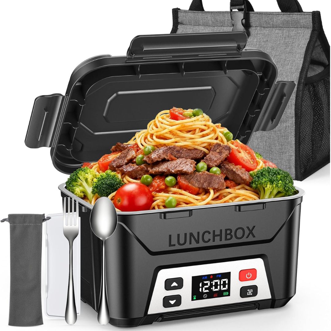 Black insulated heated outdoor lunchbox filled with spaghetti, broccoli, tomatoes, and meat, shown open with utensils in front and a gray tote bag behind on a white background.