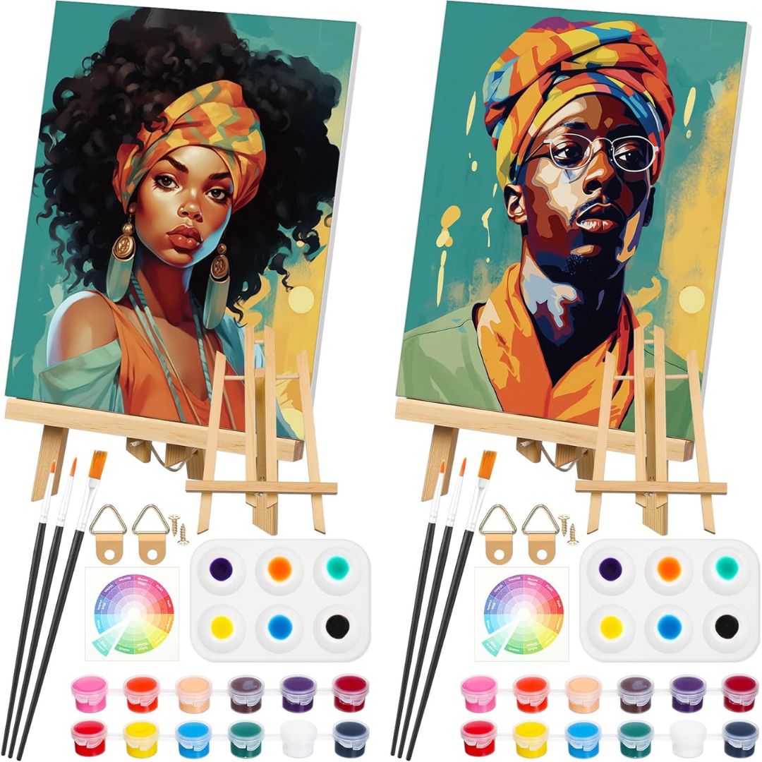 Two painted portraits on easels with art supplies including paint tubes, brushes, and color palettes.