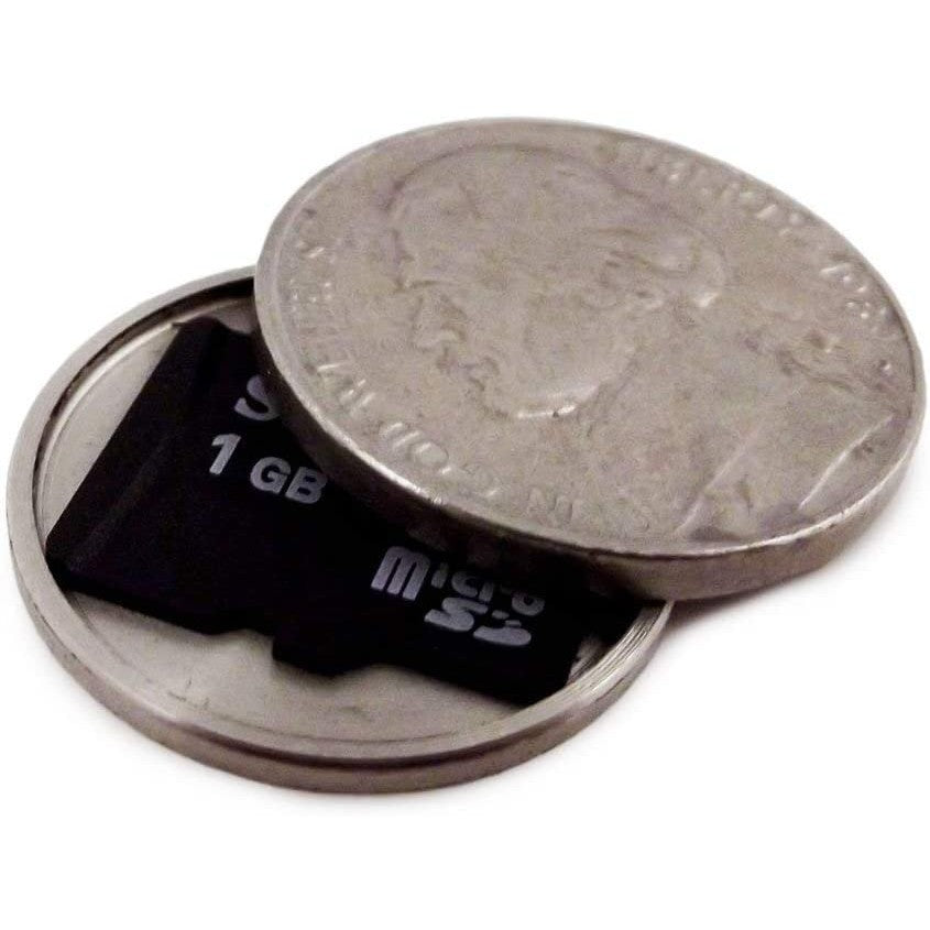 A covert hidden compartment coin with a small memory card hidden inside.