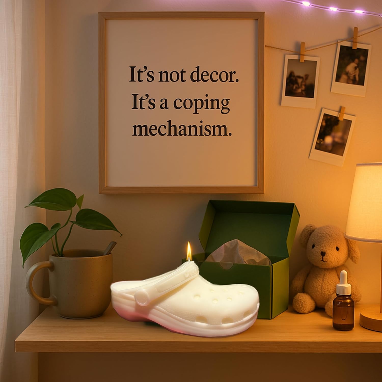 Candle shaped like a white croc shoe on a shelf with a framed quote, plant, mug, and teddy bear.