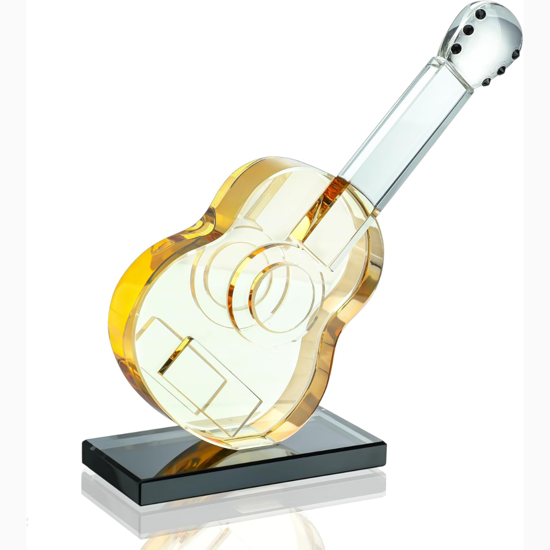 Glass guitar-shaped sculpture against a white background