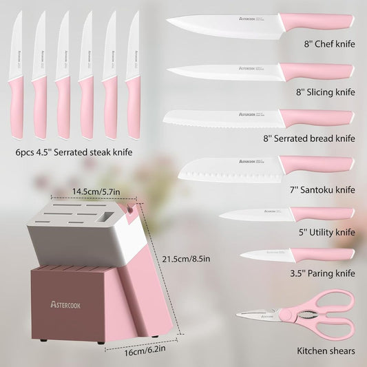 Set of knives with pink handles and a knife block on a light gray background