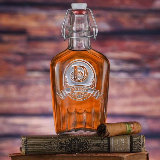 Custom engraved glass bottle of whiskey on a wooden surface with a blurred background