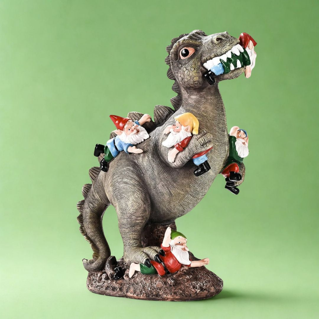 Statue of a dinosaur with gnomes riding on its back and being eaten against a green background