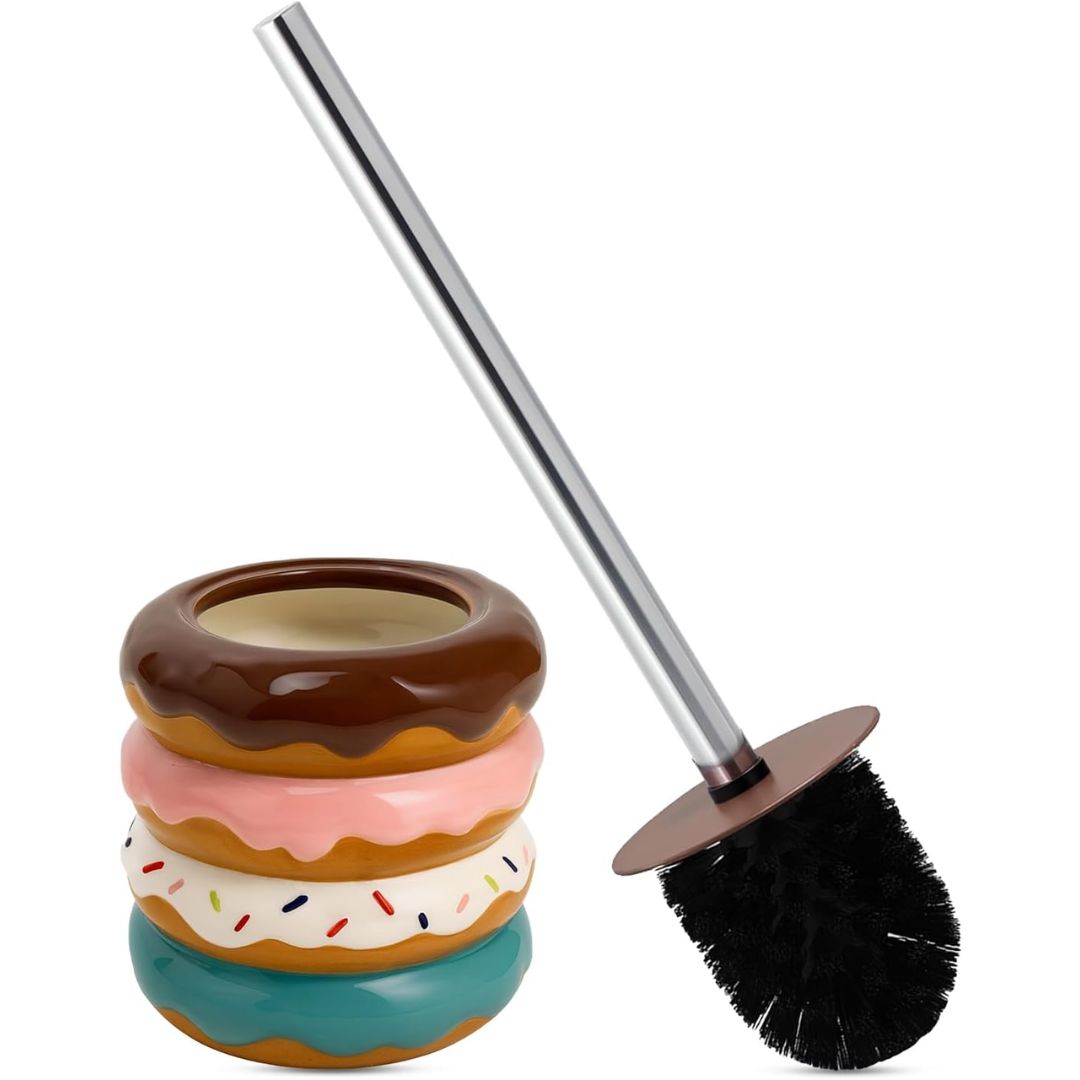 A novelty toilet brush designed to look like a stack of donuts in brown, pink, white, and teal glazes, shown next to a stainless steel handle with black bristles on a white background.