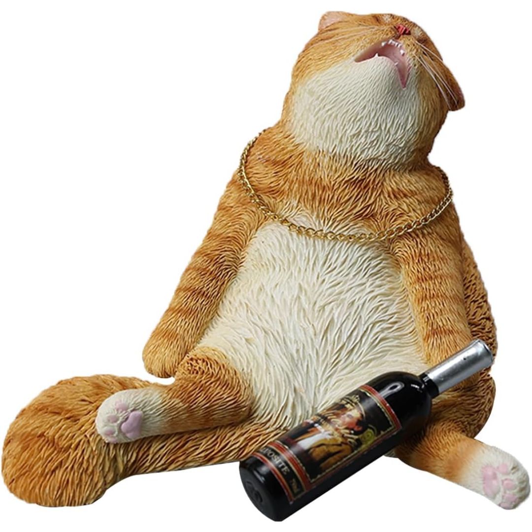 An orange and white drunk tabby cat figurine wearing a gold chain necklace, reclining with a miniature wine bottle resting on its belly, isolated on a white background.