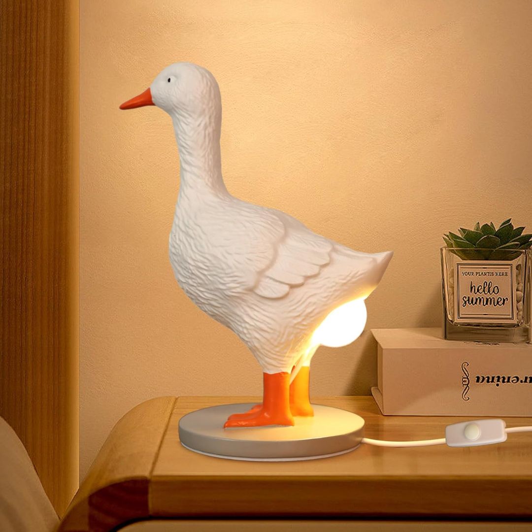 White duck lamp standing over a glowing egg night light