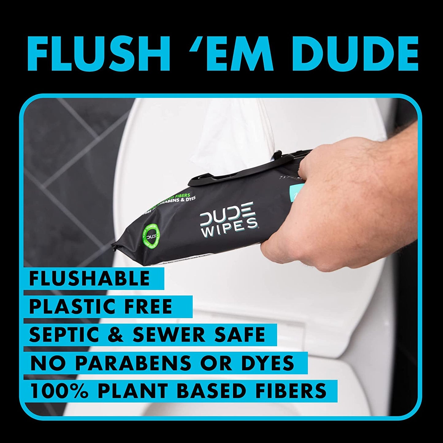 A hand is holding a pouch of dude wipes in a bathroom.