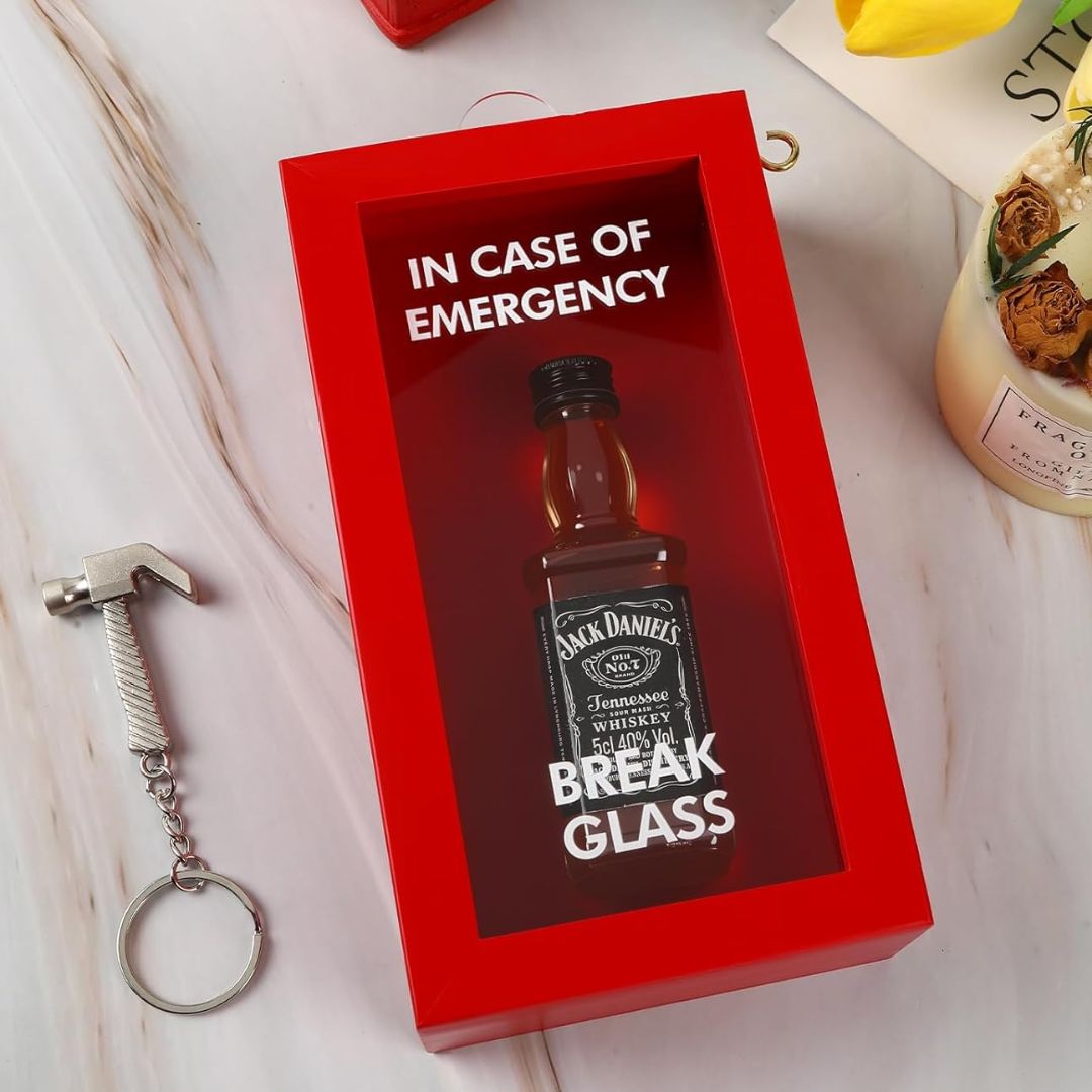 Red box with Jack Daniel's whiskey bottle and 'In case of emergency, break glass' text on a light background.