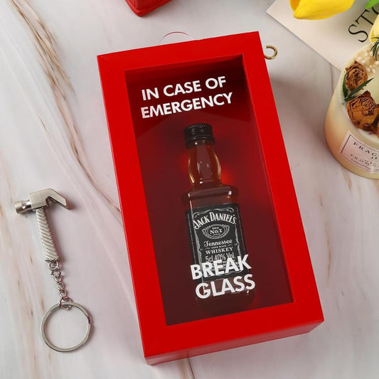 Red box with Jack Daniel's whiskey bottle and 'In case of emergency, break glass' text on a light background.