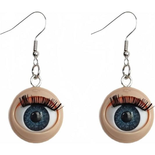 Eyeball-shaped earrings with blue eyes and long lashes on a white background