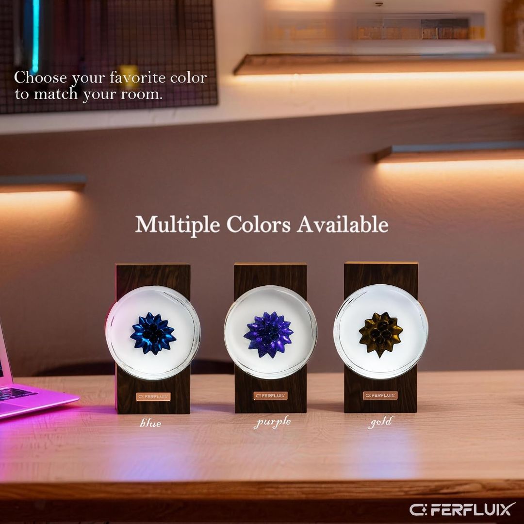 Ferrofluid music rhythm lamp displaying blue, purple and gold magnetic fluid patterns in circular glass chambers on wooden bases