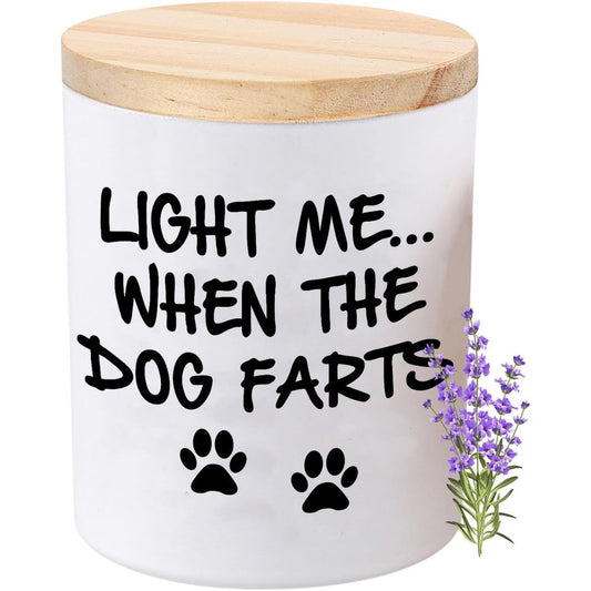 A white cylindrical jar with a light wood lid, featuring the humorous text 'Light me when the dog farts.'