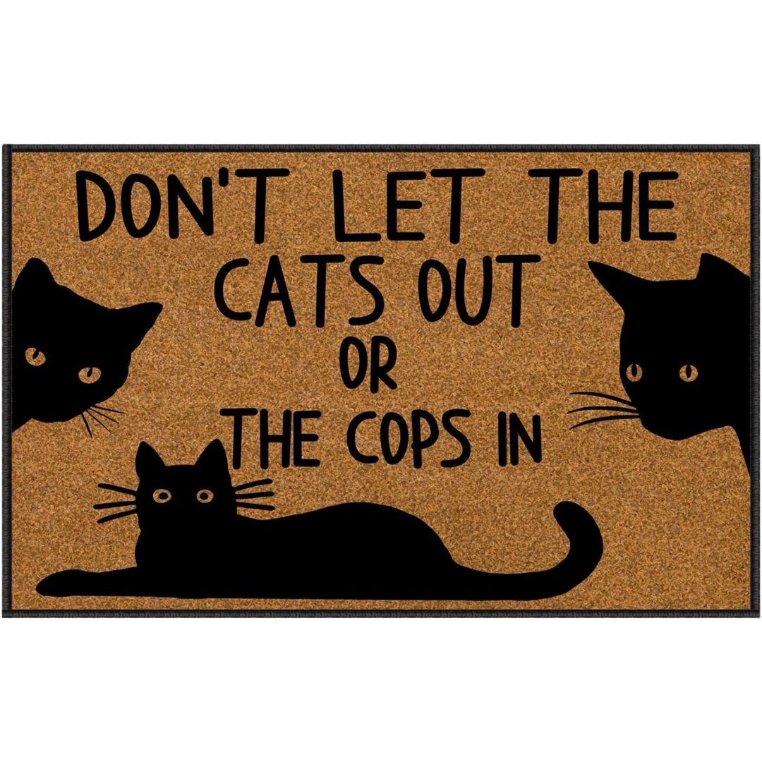 A brown door mat featuring three black cats with text that reads, "don't let the cats out or the cops in."