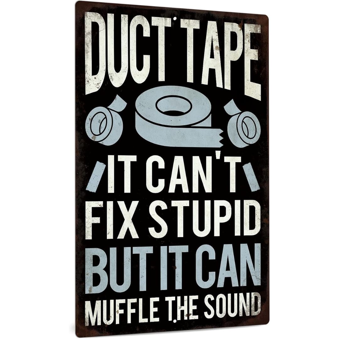 A rectangular decorative sign with a distressed dark brown background and printed slogan reading 'DUCT TAPE IT CAN'T FIX STUPID BUT IT CAN MUFFLE THE SOUND' in white and light blue text, with tape illustrations.