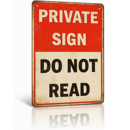 A rectangular vintage-style metal sign with a red top section reading 'PRIVATE SIGN' in cream letters and a lower cream section reading 'DO NOT READ' in black letters. The sign is shown at a slight angle on a white background with a soft reflection below.