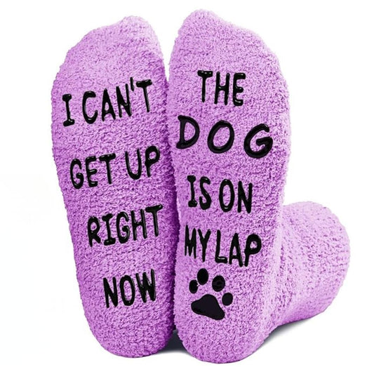 Purple socks with humorous text and paw print on a white background