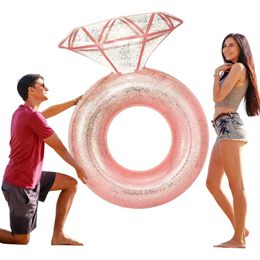 A giant pink inflatable pool float shaped like a diamond ring.