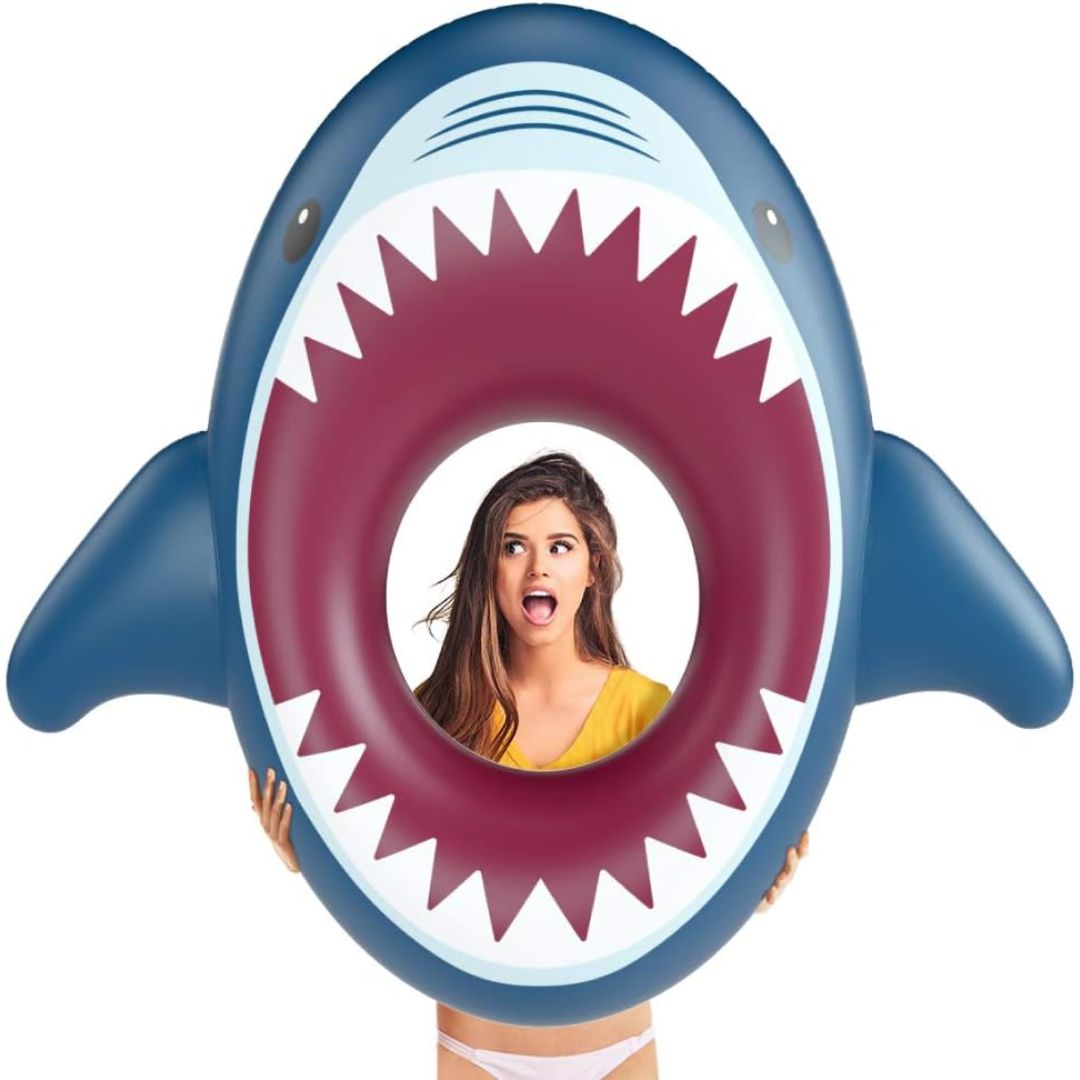 Inflatable shark pool float with a person's face inside on a white background