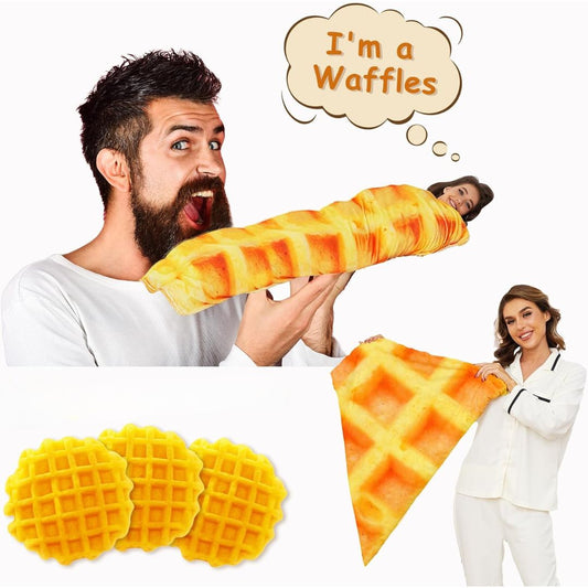 A novelty waffle-shaped plush blanket shown in a collage with two people wearing white pajamas, one holding the pillow like a waffle and the other lying wrapped inside it. The image also includes three round waffle-shaped blankets and a triangular waffle-shaped blanket on a plain white background, with a speech bubble that says 'I'm a Waffles'.