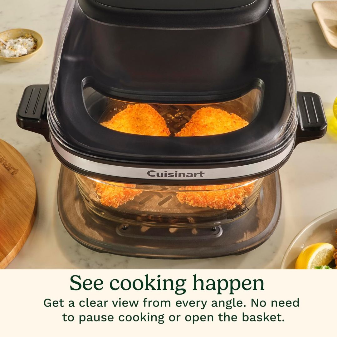 Cuisinart glass air fryer with ingredients inside on a kitchen counter.