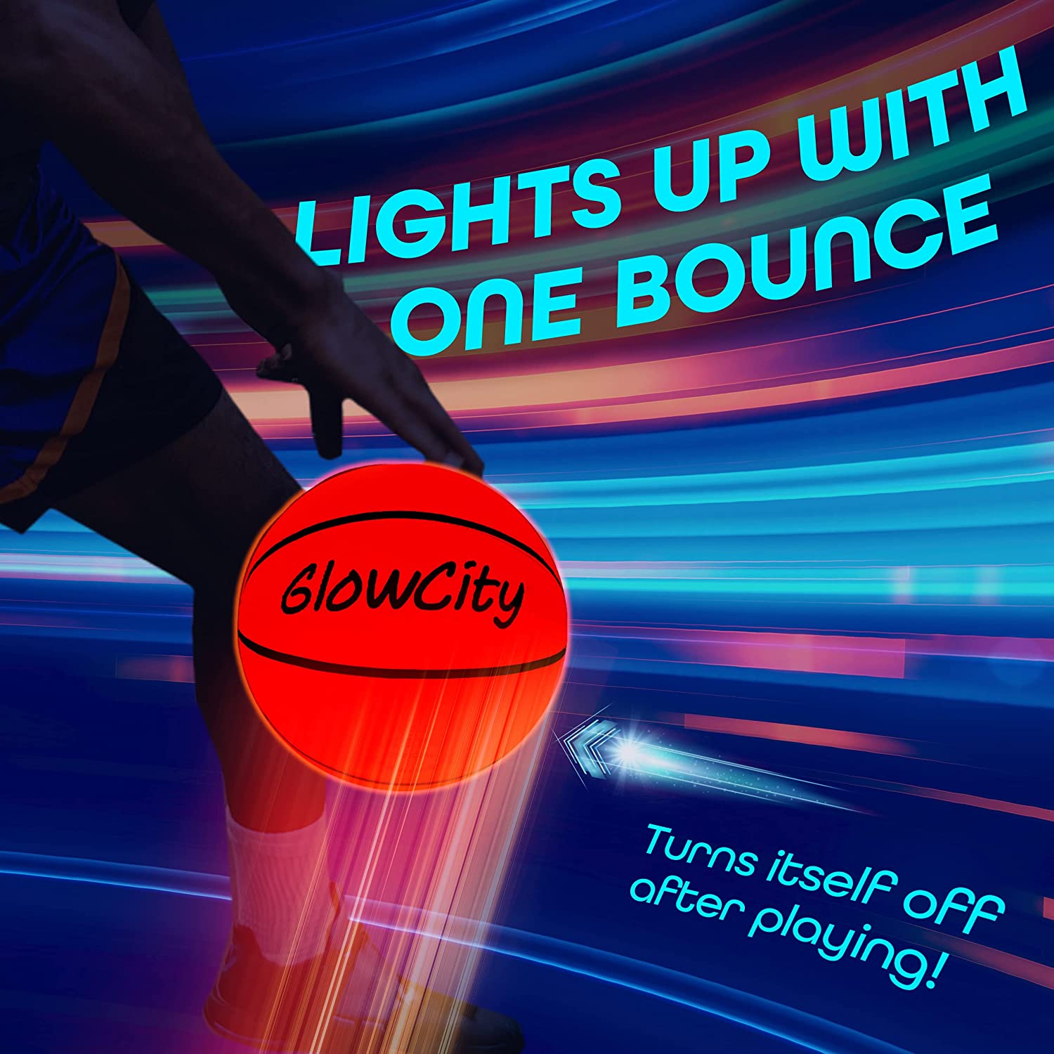 A person is bouncing a Glowcity glow in the dark basketball which is lit up.