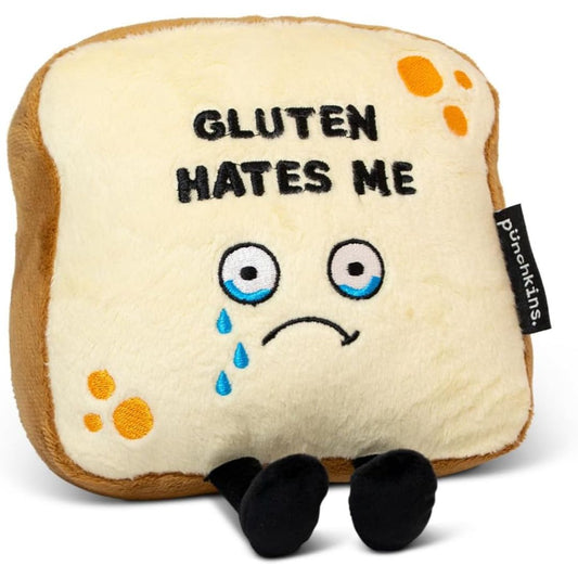 Plush toy resembling a piece of bread with 'GLUTEN HATES ME' text and a sad expression.
