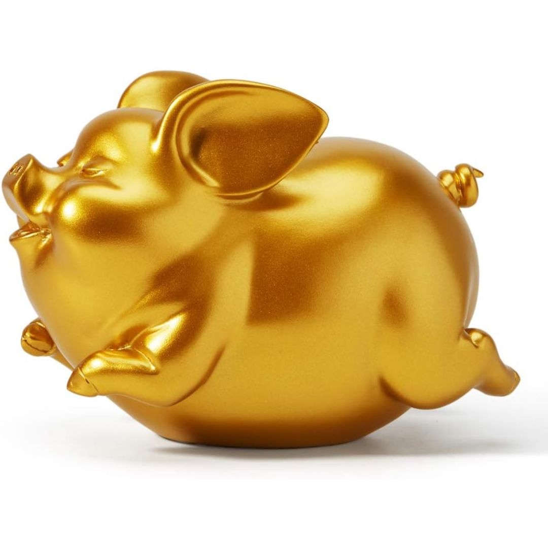 Gold flying pig coin bank and decorative statue