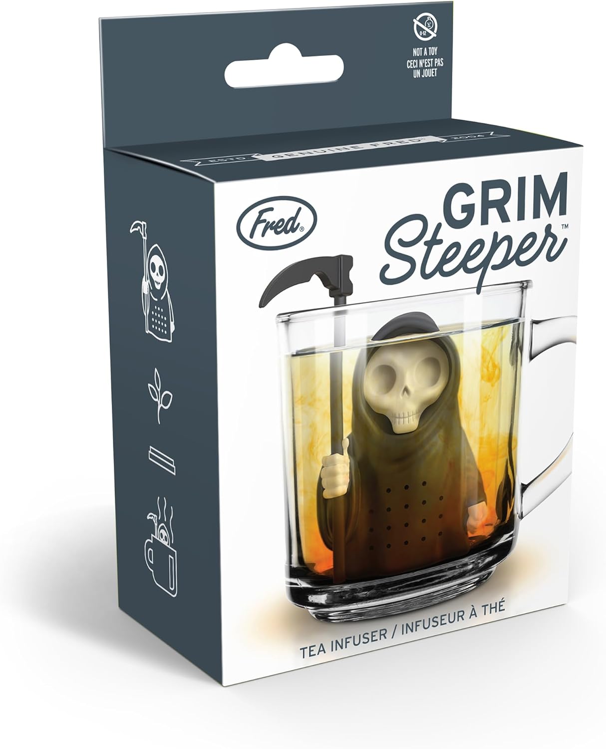 A box labeled "Grim Steeper" by Fred, showing a Grim Reaper tea infuser in a glass cup, with "Tea Infuser" text and "Not a Toy" warning.
