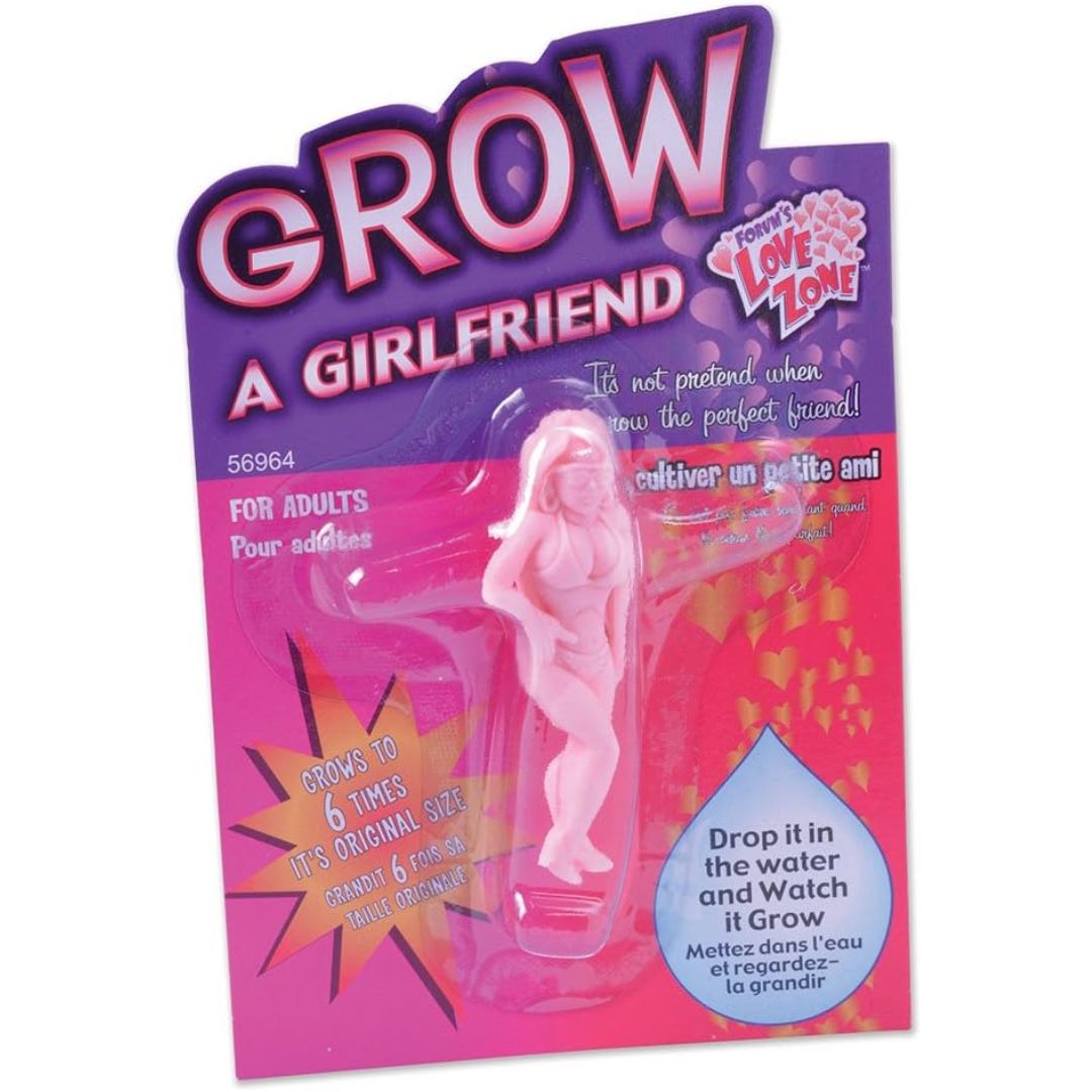 Product packaging for 'Grow a Girlfriend' toy with pink and purple design.