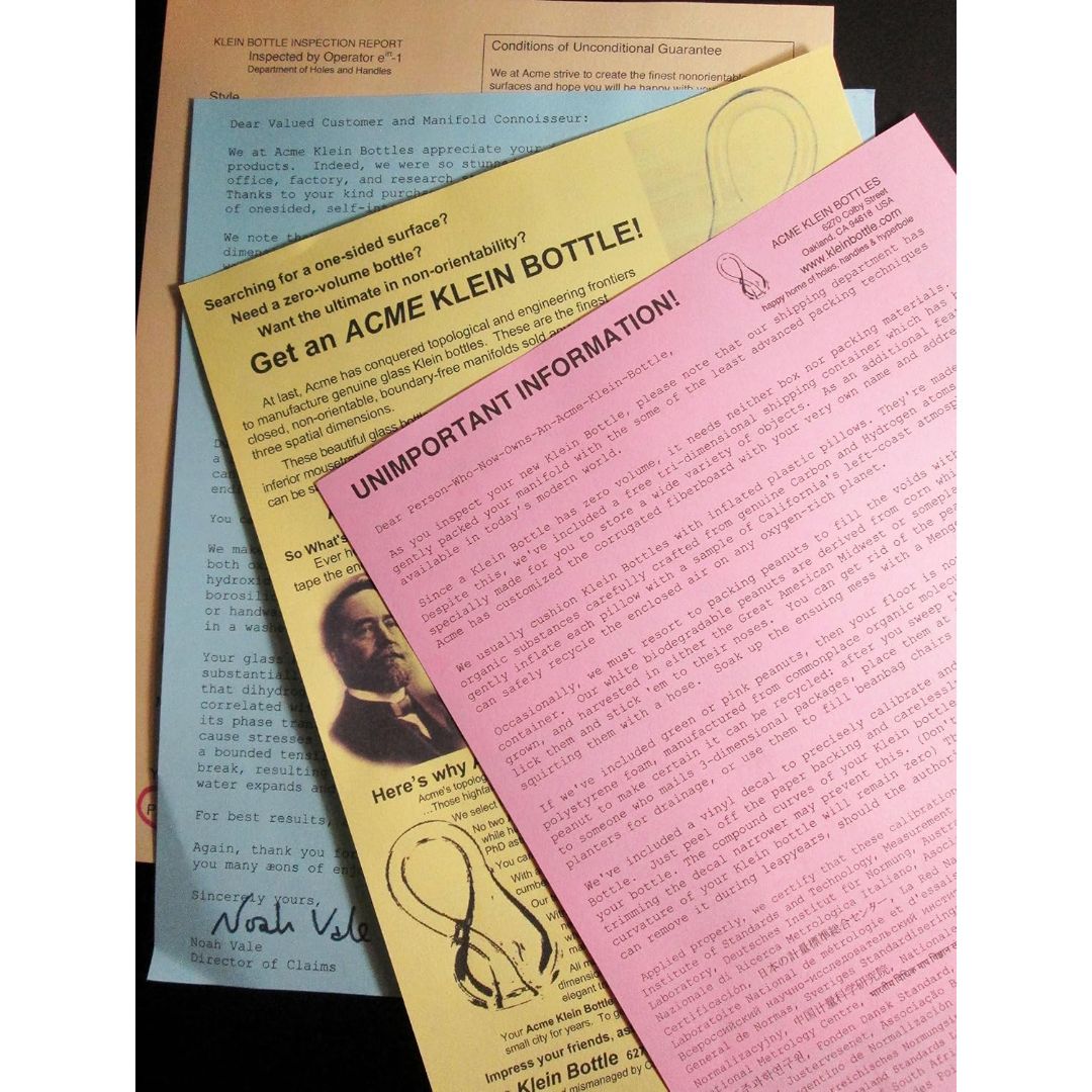 Handmade glass Klein bottle information sheets with inspection report, guarantee and product background details