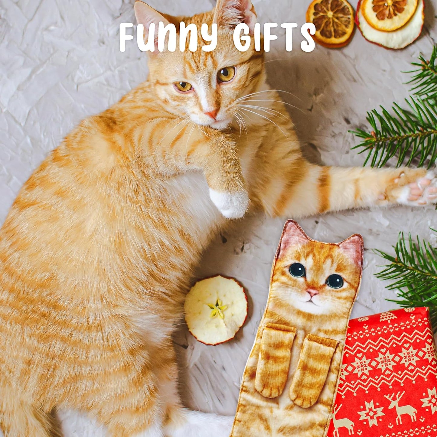 Orange tabby cat laying next to a cat-shaped hand tea towel on a textured surface with decorative elements.